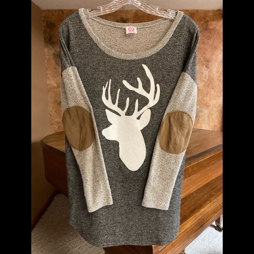 Wanna B boutique reindeer lightweight sweatshirt.  Feels similar to a sweater.